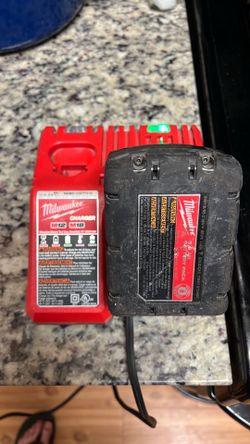 MILWAUKEE M18 BATTERY AND DUEL CHARGER