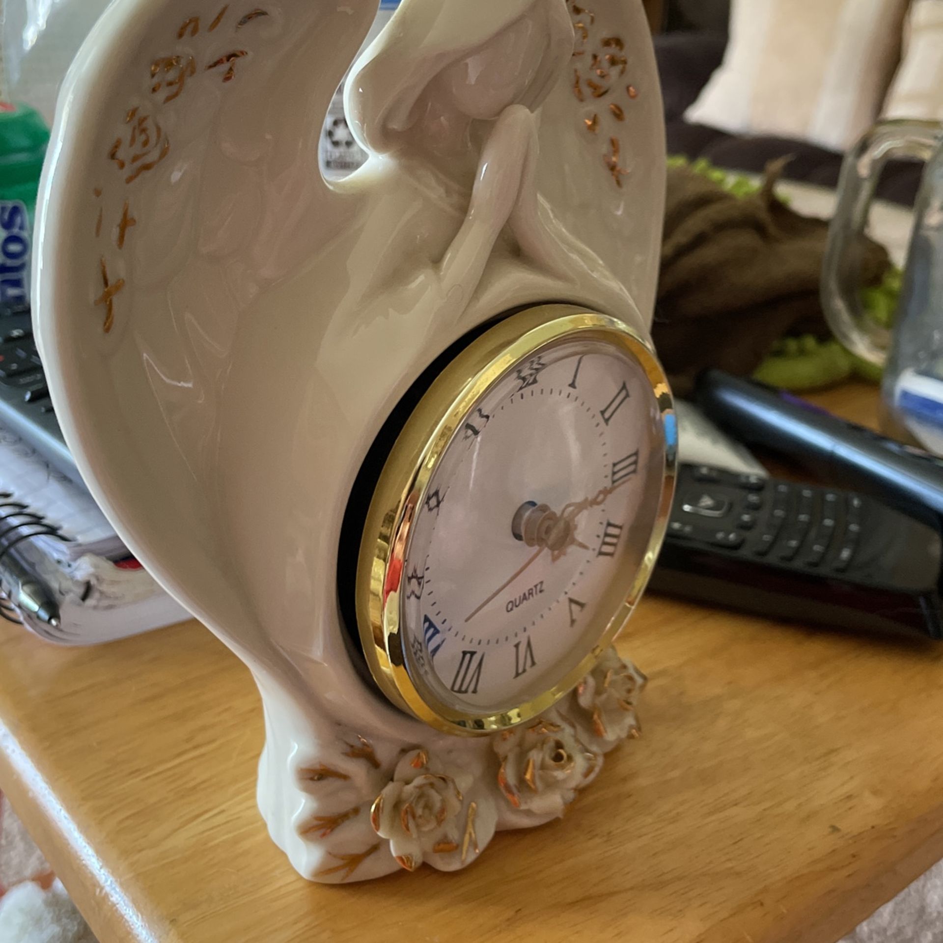 Beautiful angel clock with flowers on the bottom around the wings. Or Best Offer