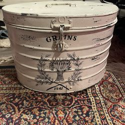 Vintage aluminum storage container says “Grains”, with lockable latch