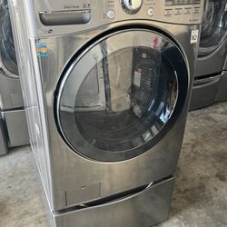 Graphite steel front load lg  steam washer  with pedestal high efficiency working perfectly extra for delivery same day delivery and installation avai