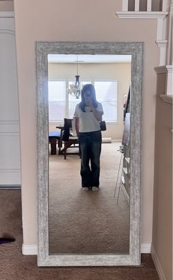 Leaning mirror with wooden frame