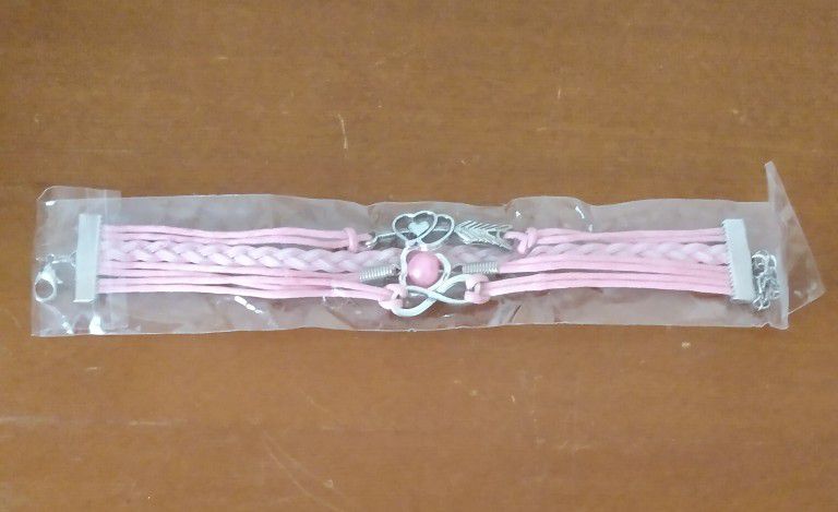 BRAND NEW IN PACKAGE LADIES PINK LEATHER MULTI CHARM BRACELET INFINITY SYMBOL HEARTS PINK PEARL WOVEN IN BRAIDED CUFF WITH EXTENDER