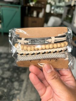 achieve Wooden and leather bracelet with the word “achieve”