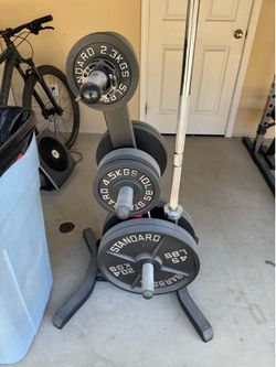 Olympic weights, barbell, plates and bench