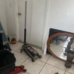 One  3 Tone Mecanic Floor Jack Like New