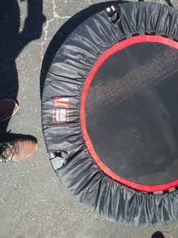 Foldaway trampoline with holding bar