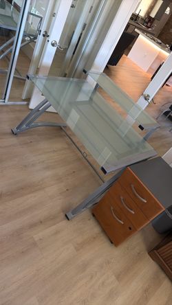 Contemporary metal desk with tempered glass top. Plus filing cabinet.