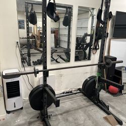 Squat rack / Bench press with barbell and weights