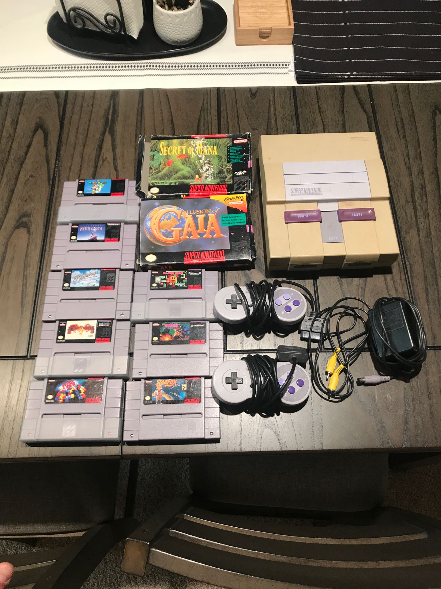 Super Nintendo with two controllers and 10 games. Missing AV cord