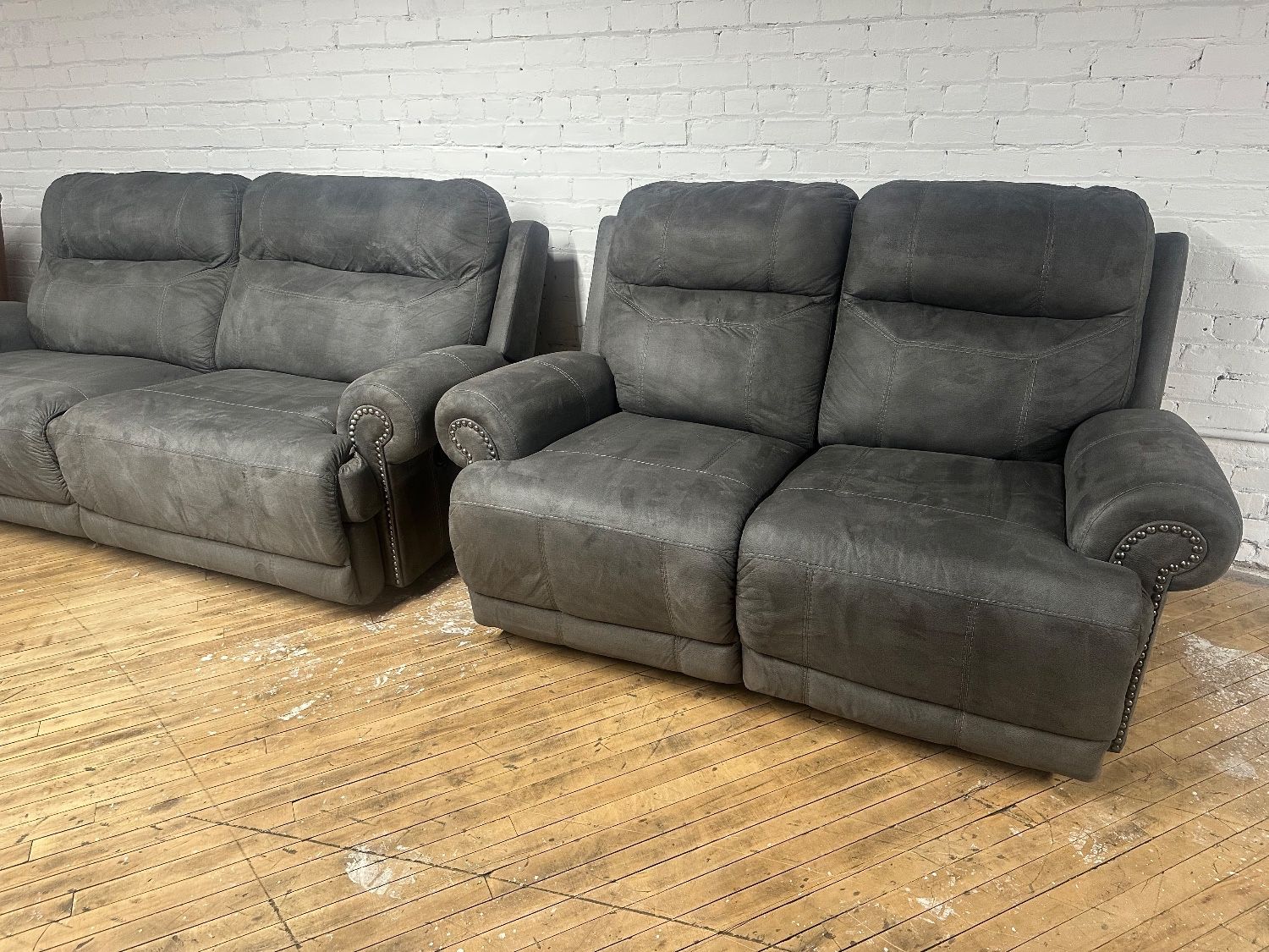 Free Delivery- Ashley Furniture gray reclining sofa loveseat couch set