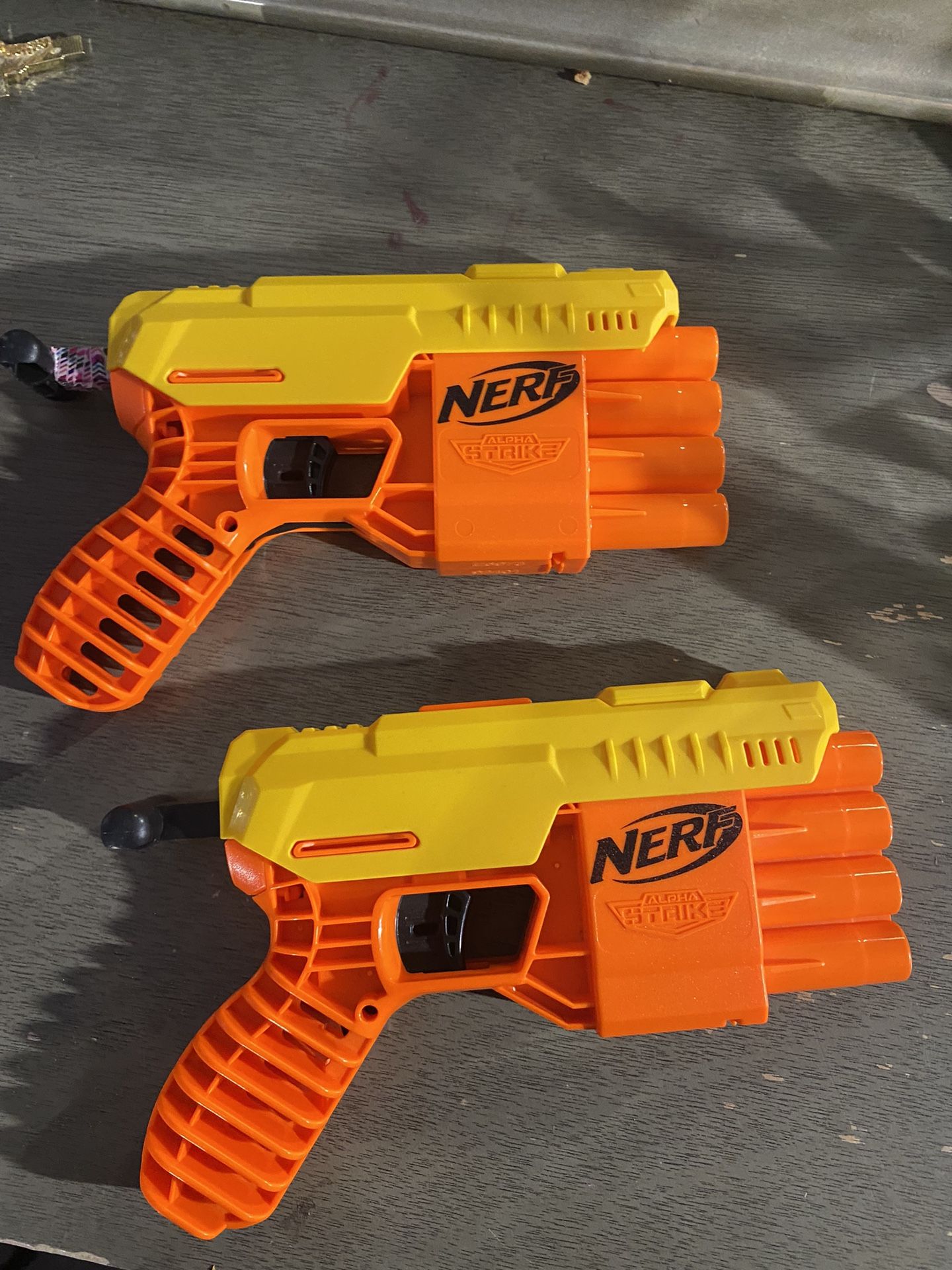 2 Nerf Guns And a Box Full Of Darts