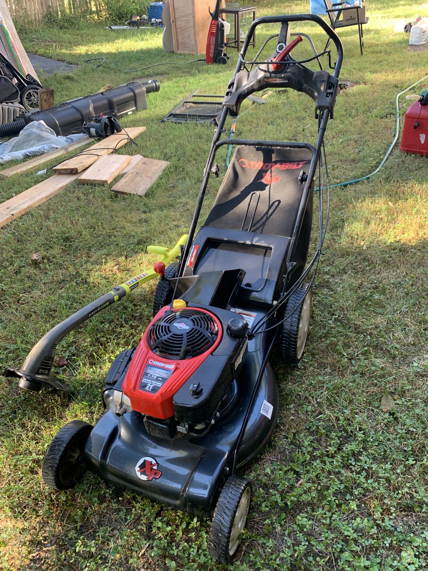 Troy Bilt and Ryobi Trimmer (no battery just the charger)