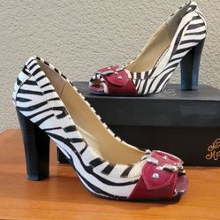 Used Naughty Monkey zebra print block heels.