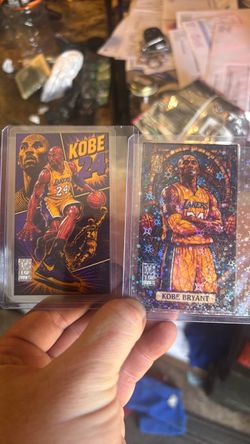 1GR .999 Fine Silver Kobe Bryant Lakers cards and one is holo prism ish