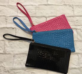 3 wristlet clutched