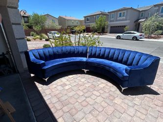 Legend furniture blue velvet oversized curved sofa.