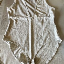H&M gray sleeveless bodysuit featuring a mesh panel neckline. Medium