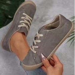 Grey slip on lace up tennis shoes size 7.5