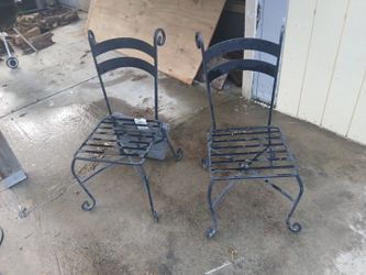 Wrought Iron chair set with curved legs and umbrella stand
