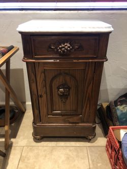 Antique side cabinet table marble top what wheels skeleton key hole grape design pull handle