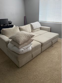 Modular sectional sofa with storage chaise and ottoman