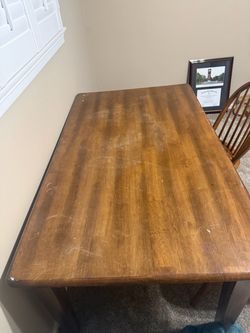 Free table and 2 chairs some damage noted