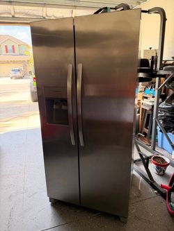 Frigidaire stainless steel refrigerator one year-old