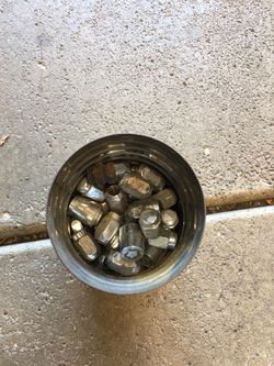 Can of chrome lug nuts.