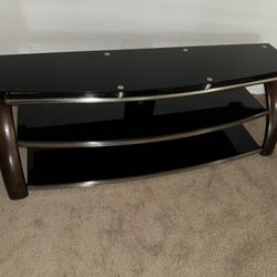 Beautiful black and espresso TV stand with stylish silver accents