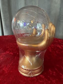 Gold Hand Holding Crystal Ball Snow Globe