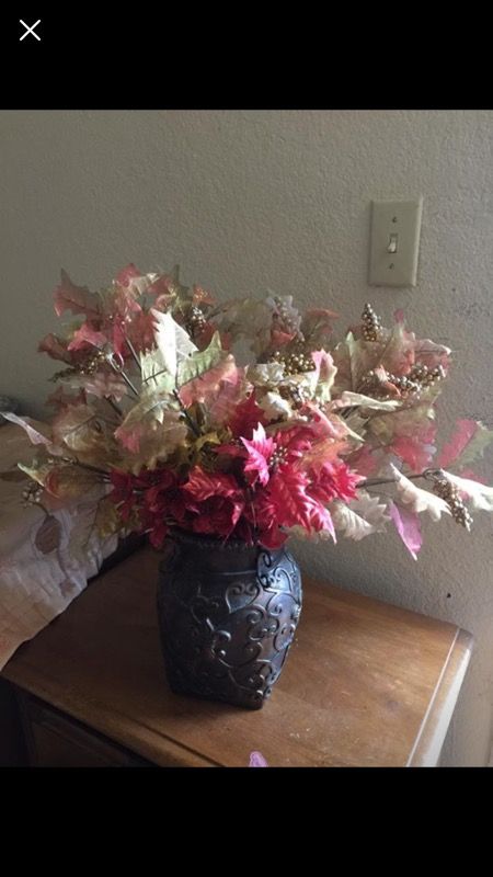 Flower vase and lot of fall leaves
