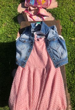 Cute pink dress with no sleeves jean jacket.