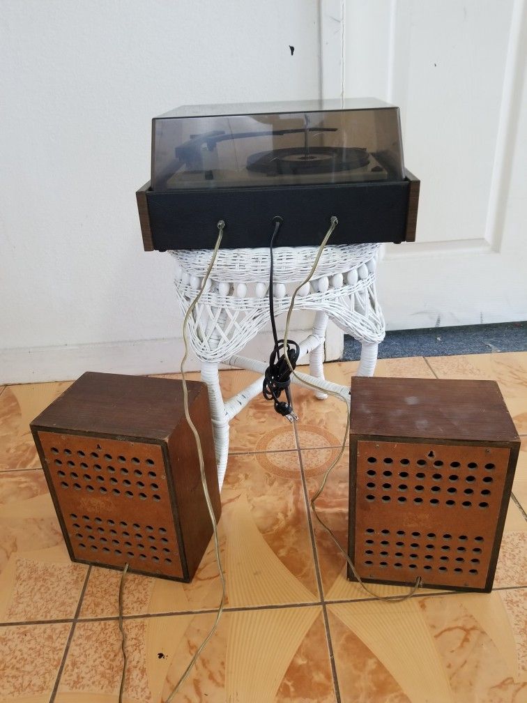 Solid state stereo component record player with speakers