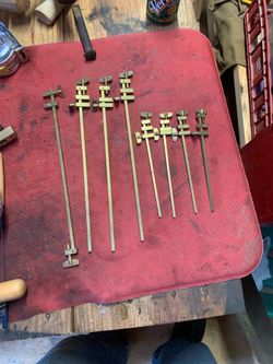 These are traditional Japanese Hatagane brass clamps designed for fine woodworking projects.