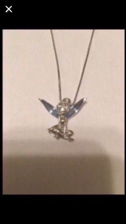 Silver with crystal wings. Never worn. Brand new.
