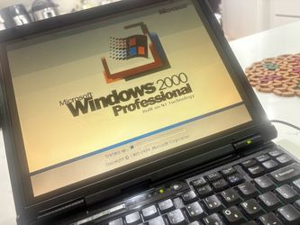 The IBM Lenovo T Series ThinkPad T21 2648-4AU is a black 14.1-inch laptop with an Intel Core 2 Duo processor running at 800GHz. It comes with 512 MB o