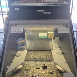 Coin pusher/quarter machine