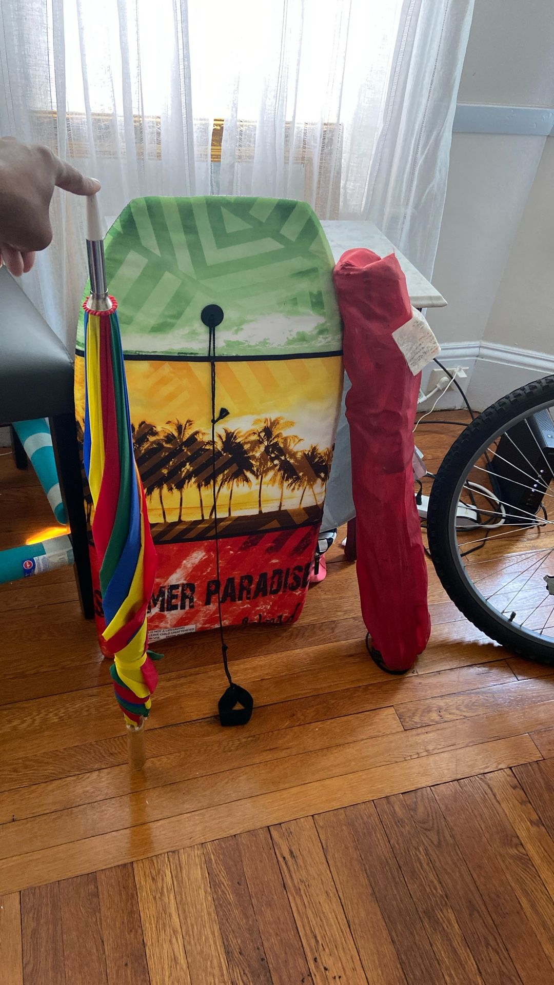 Boogie Board And Beach Umbrella With A Chair