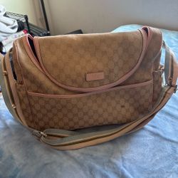 Beige and pink Gucci diper bag