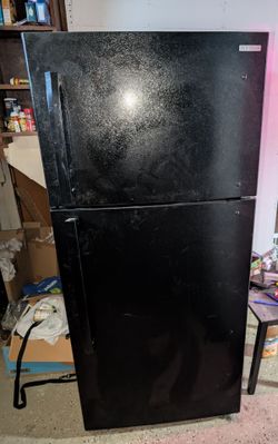 Insignia top-freezer refrigerator in a textured black finish
