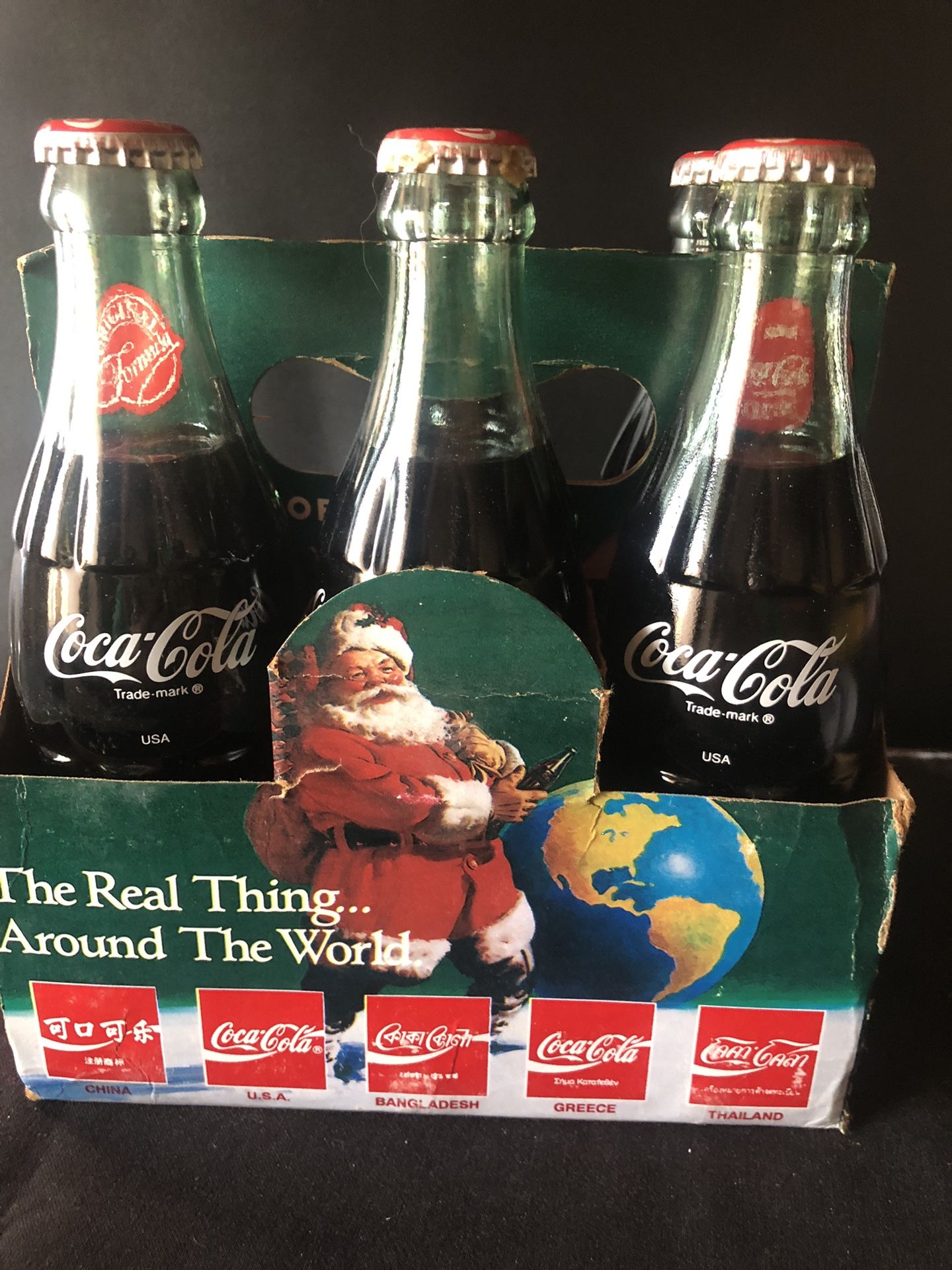 Vintage Coco Cola Bottles “ Christmas Around The World “