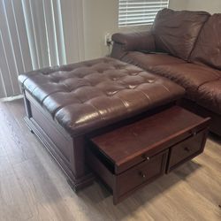 Large Tufted Leather Ottoman with Solid Wood Base. Storage Drawers, and slide out tables.
