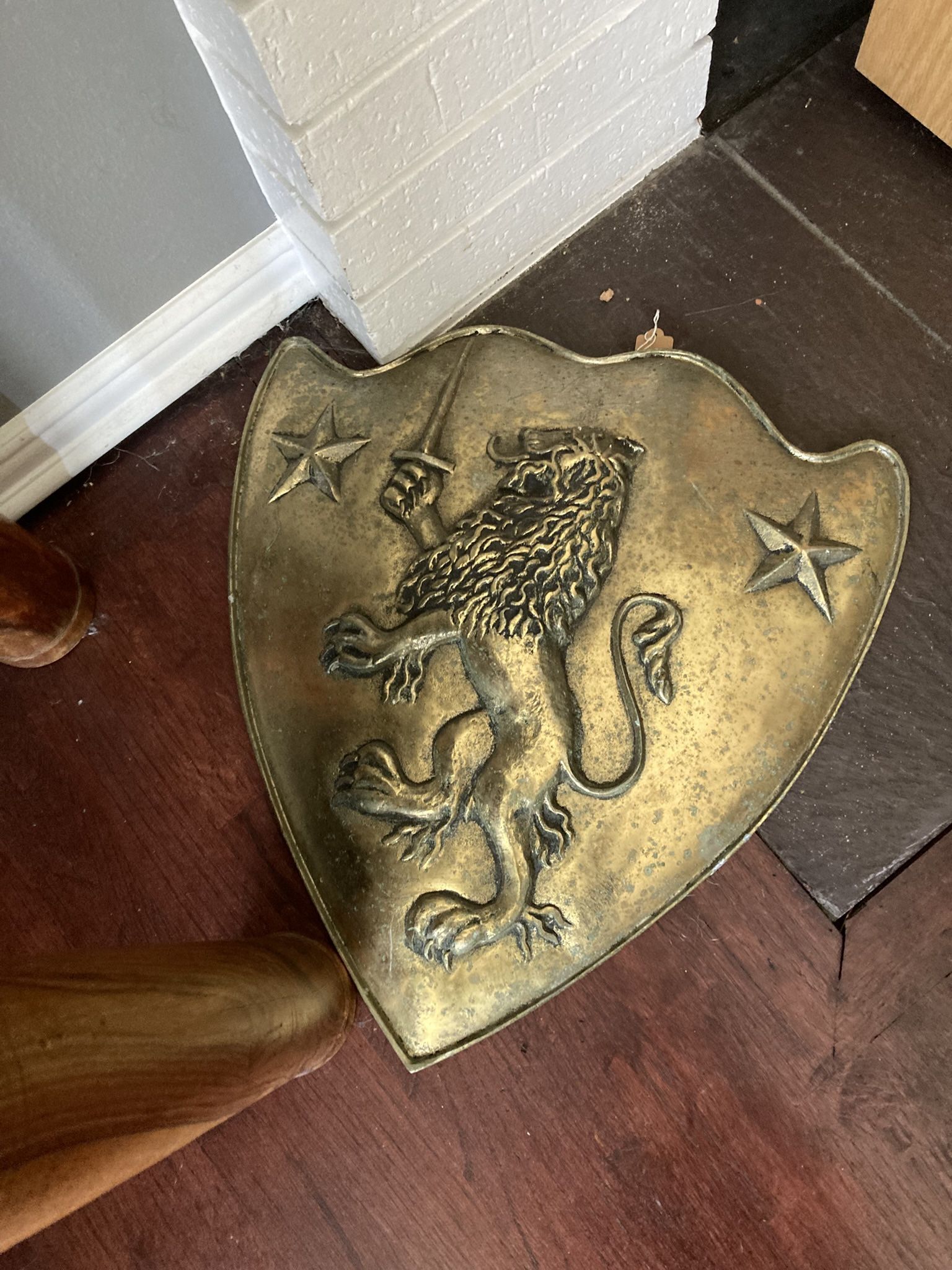 Metal medieval style shield with Lion holding a sword