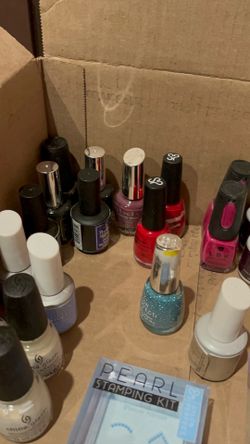 Box of nail polish, gel polish, clear coat and press on nails