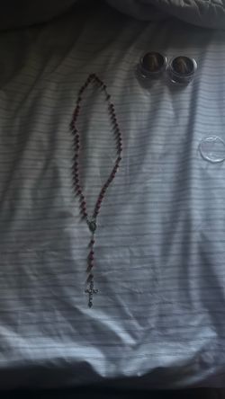 Red rosary with Jesus on it