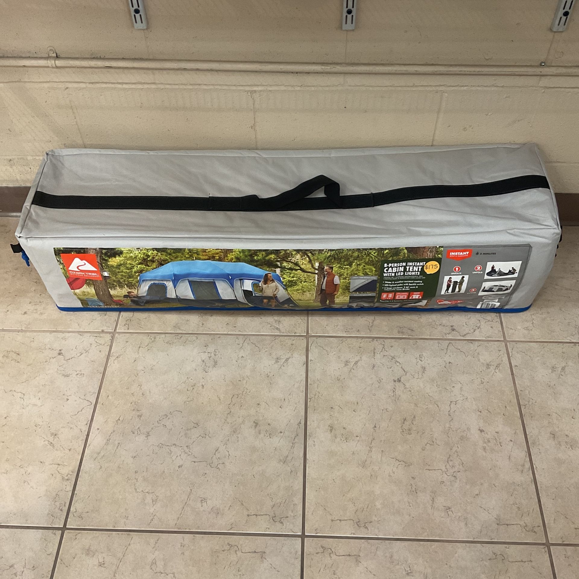 OZARK TRAIL 8-PERSON INSTANT CABIN TENT WITH LED LIGHTS.