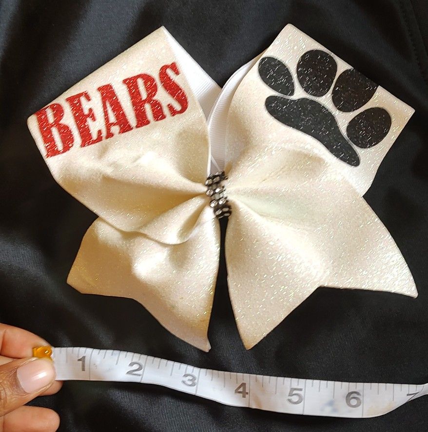 New Bern bears (white) bow