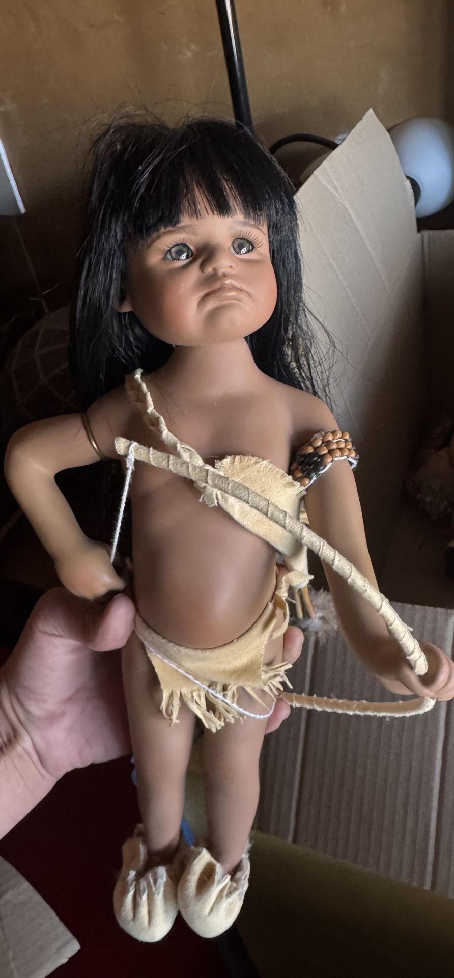Native American-style doll, possibly inspired by Kachina dolls. Kachina dolls are traditionally made by Hopi and other Pueblo peoples and represent sp