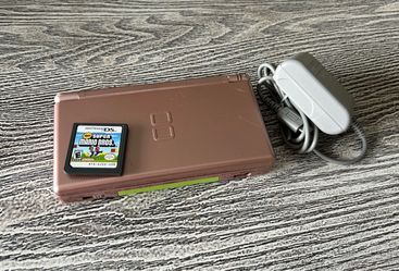 Metallic Gold Nintendo DS with Mario Bros. game, complete with charger. $65