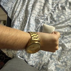 Gold Nixon watch big face